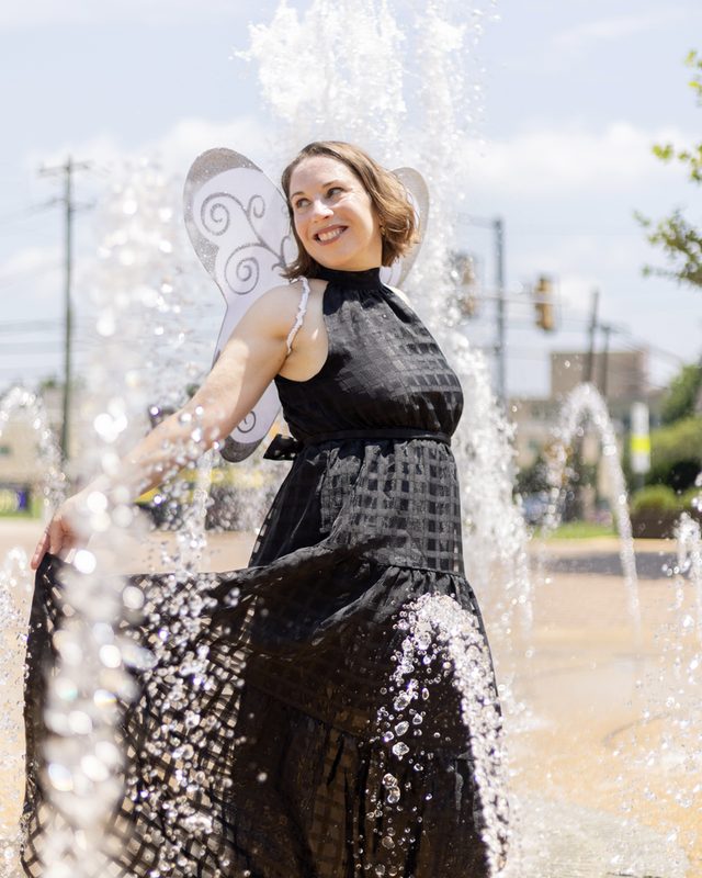 Francesca Merritt in a fountain, skirt in motion